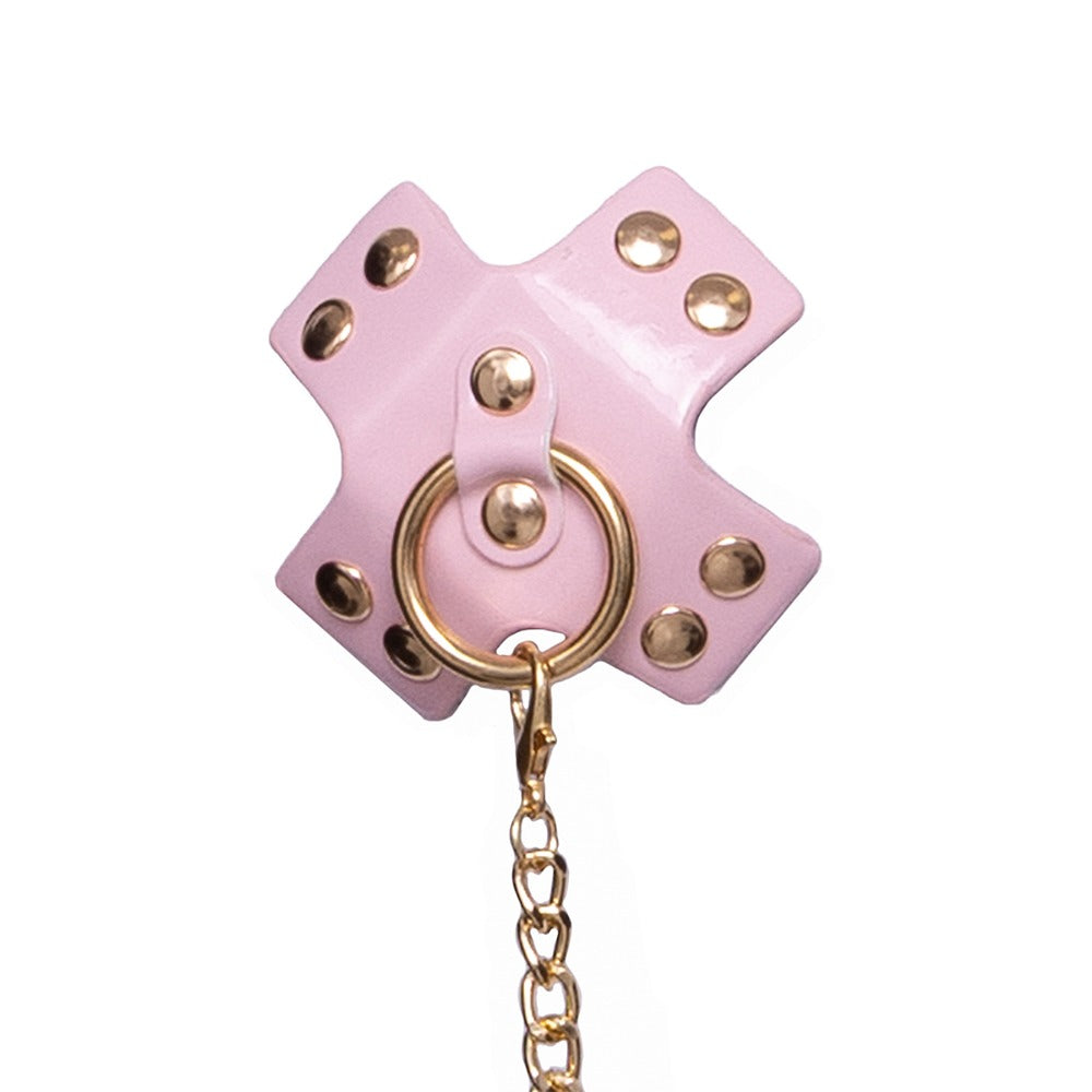 Bad Kitty brysttilbehør med to X-formede covers og guldfarvet kæde
