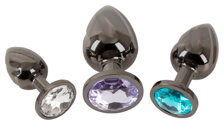 Metal anal plugs med klar, turkis og lilla sten i bunden