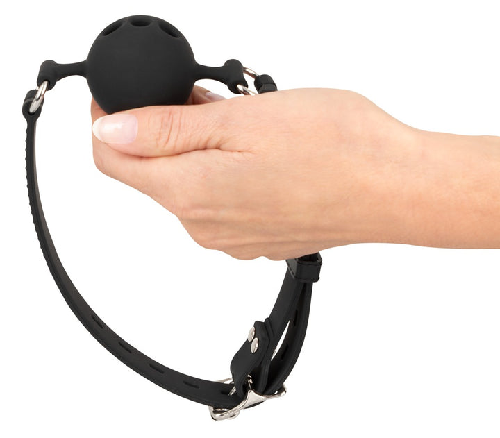 Sort silikone ball gag med åndehuller og justerbar rem