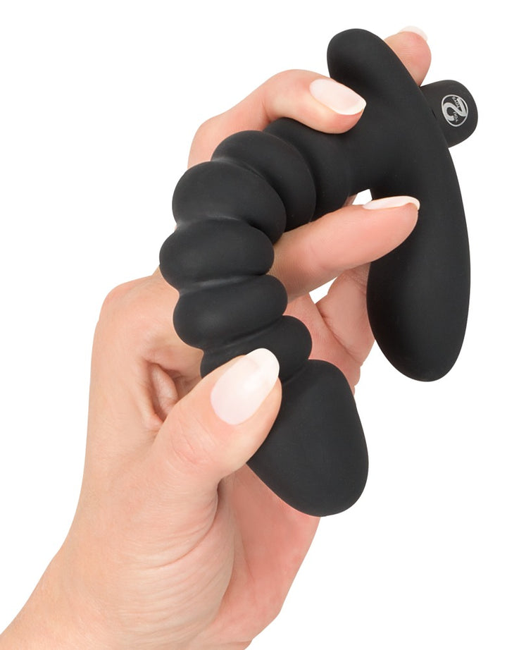 Sort vibrator med internt skaft og ekstern ankerstimulator